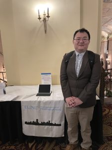 DCRP's table at the ACSP conference (pictured with PhD student Xijing Li)